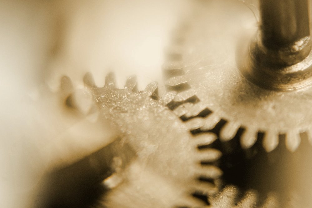 Macro photograph of interlocking brass gears